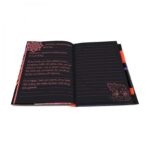 Nebulous Stars quaderno deluxe aperto: pagine nere con righe e penna